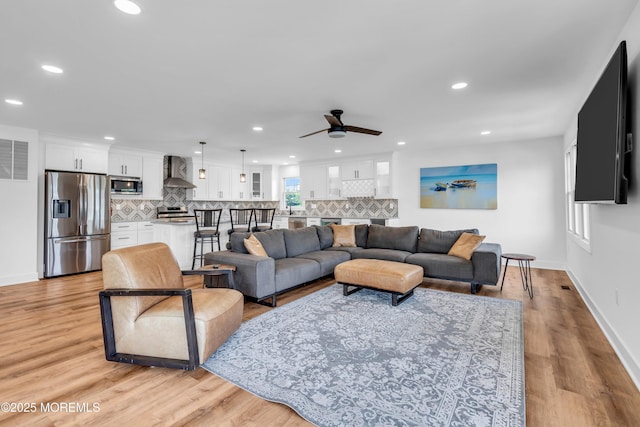 303 Forman Ave, Point Pleasant Beach, NJ 08742 - living area with a ceiling fan, recessed lighting, light wood finished floors, and baseboards