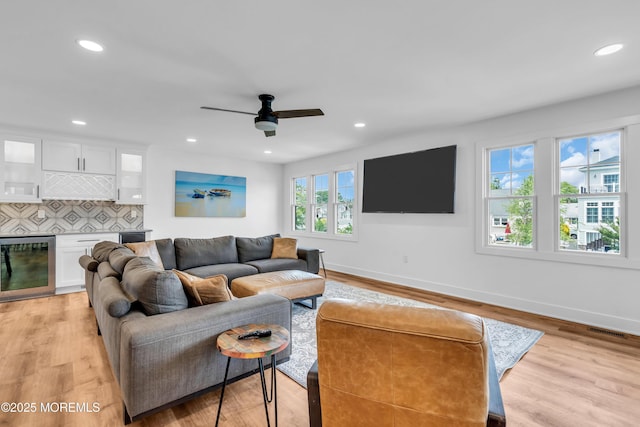 303 Forman Ave, Point Pleasant Beach, NJ 08742 - living area with beverage cooler, baseboards, light wood finished floors, and recessed lighting