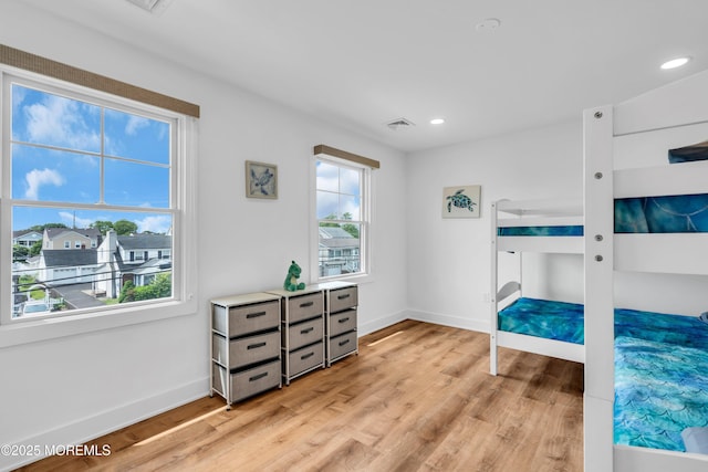 303 Forman Ave, Point Pleasant Beach, NJ 08742 - unfurnished bedroom featuring multiple windows, light wood-type flooring, baseboards, and recessed lighting