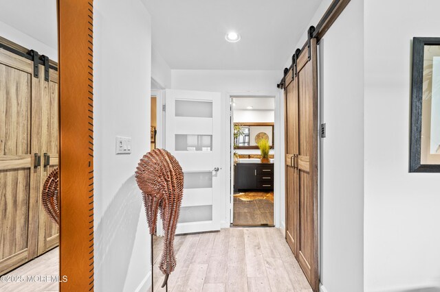 68 Winthrop Rd Unit 68B, Monroe, NJ 08831 - corridor featuring a barn door, light wood-style floors, recessed lighting, and built in features