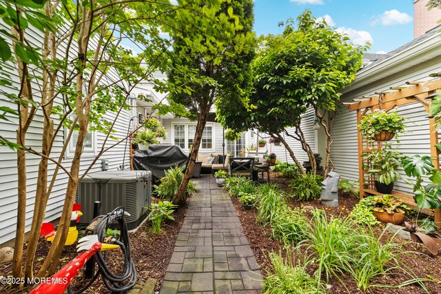 68 Winthrop Rd Unit 68B, Monroe, NJ 08831 - view of yard with a pergola, central AC, an outdoor living space, and a patio area