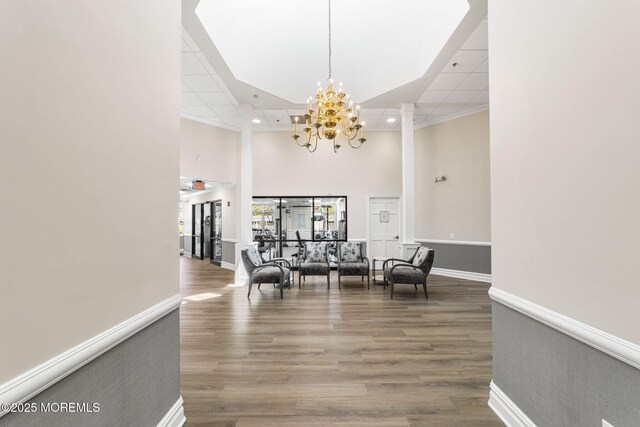 68 Winthrop Rd Unit 68B, Monroe, NJ 08831 - hallway with a chandelier, a towering ceiling, wood finished floors, recessed lighting, and baseboards