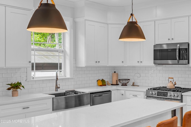 804 Linden Rd, Toms River, NJ 08753 - kitchen with stainless steel appliances, a sink, white cabinetry, and backsplash