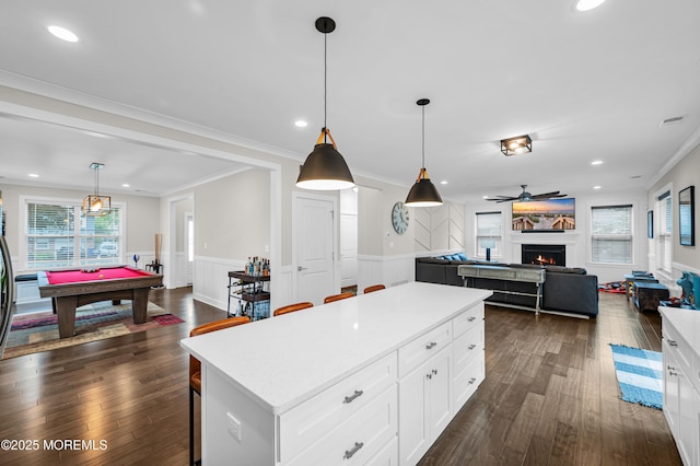 804 Linden Rd, Toms River, NJ 08753 - kitchen with dark wood finished floors, billiards, a center island, light countertops, and a wainscoted wall
