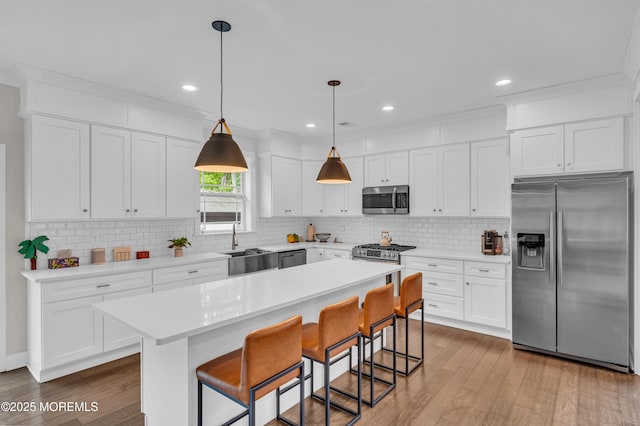 804 Linden Rd, Toms River, NJ 08753 - kitchen with stainless steel appliances, wood finished floors, tasteful backsplash, a sink, and recessed lighting