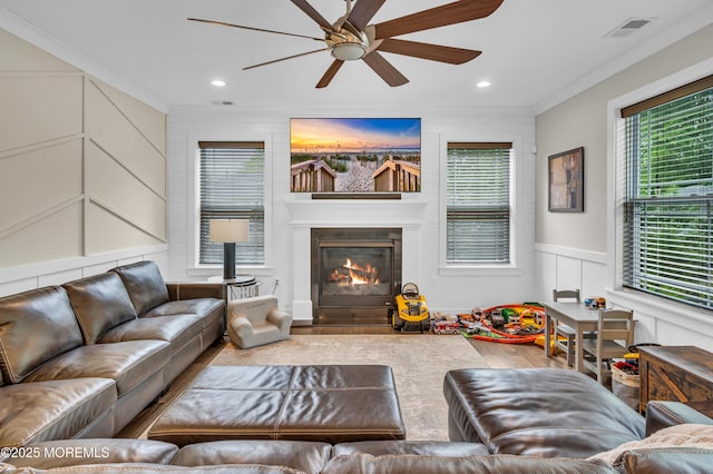 804 Linden Rd, Toms River, NJ 08753 - living room featuring wood finished floors, ceiling fan, crown molding, a glass covered fireplace, and recessed lighting