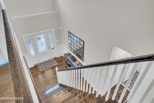 804 Linden Rd, Toms River, NJ 08753 - foyer with wood finished floors, wainscoting, stairs, a decorative wall, and a high ceiling