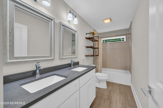 804 Linden Rd, Toms River, NJ 08753 - bathroom with double vanity, toilet, shower / tub combo with curtain, wood finished floors, and baseboards