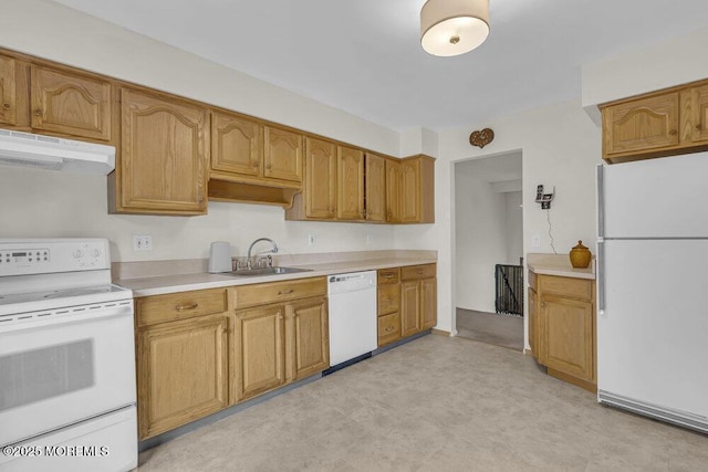 44 Hoover St, Freehold, NJ 07728 - kitchen with white appliances, under cabinet range hood, a sink, light countertops, and light flooring