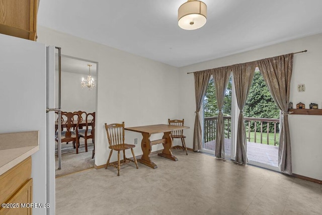 44 Hoover St, Freehold, NJ 07728 - dining area with a chandelier and baseboards
