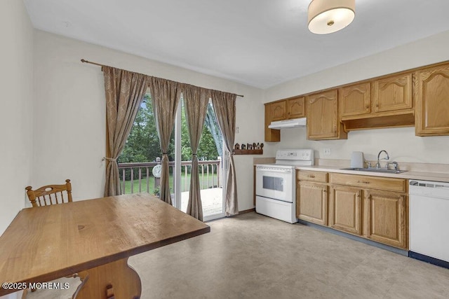44 Hoover St, Freehold, NJ 07728 - kitchen featuring white appliances, under cabinet range hood, a sink, and light countertops