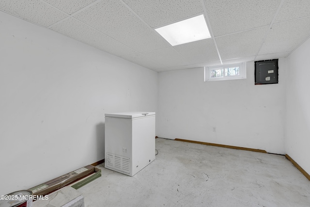 28 Roberta Dr, Howell, NJ 07731 - below grade area with fridge, electric panel, and a paneled ceiling