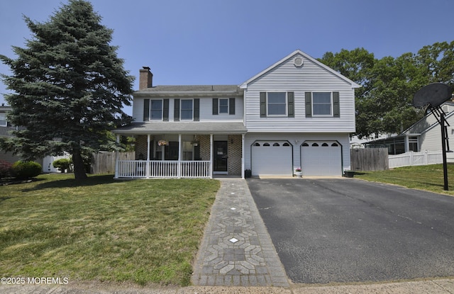 15 Tamarack St, Howell, NJ 07731 - view of front of property with a chimney, a garage, driveway, and covered porch
