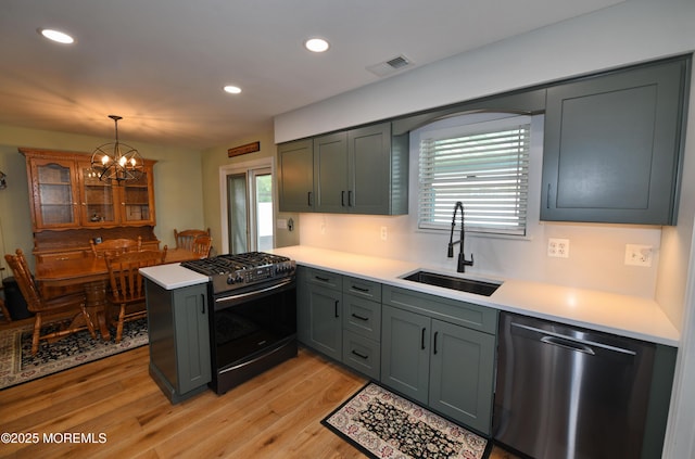 15 Tamarack St, Howell, NJ 07731 - kitchen featuring stainless steel dishwasher, black gas range, a peninsula, light countertops, and recessed lighting