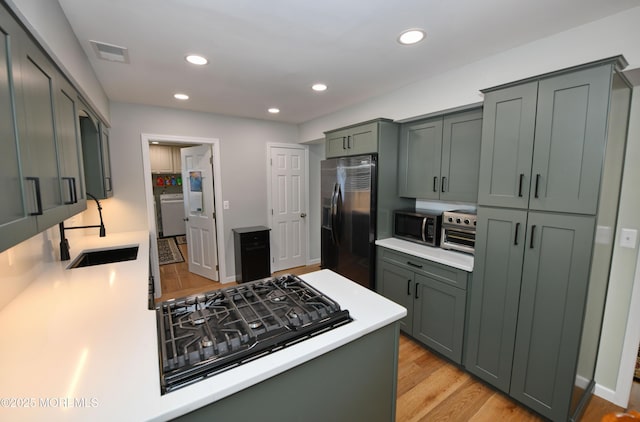 15 Tamarack St, Howell, NJ 07731 - kitchen with fridge with ice dispenser, stainless steel microwave, stovetop, light countertops, and recessed lighting