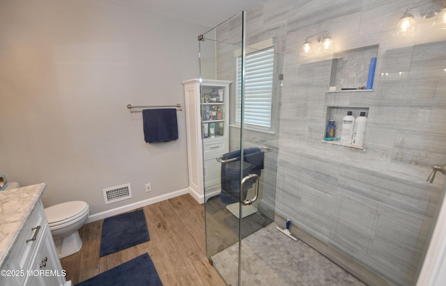 15 Tamarack St, Howell, NJ 07731 - bathroom with vanity, a shower stall, and wood finished floors