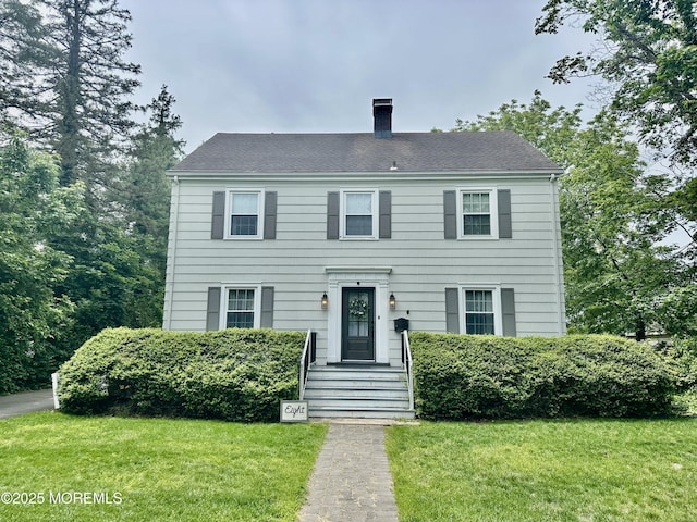 8 Spruce St, Toms River, NJ 08753 - colonial inspired home with a chimney and a front lawn