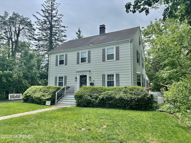 8 Spruce St, Toms River, NJ 08753 - colonial inspired home featuring a chimney and a front lawn