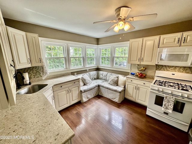 8 Spruce St, Toms River, NJ 08753 - kitchen featuring white appliances, healthy amount of natural light, a sink, and backsplash