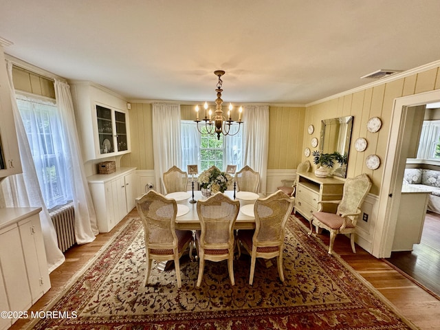8 Spruce St, Toms River, NJ 08753 - dining room with a chandelier, dark wood-style flooring, ornamental molding, and a decorative wall