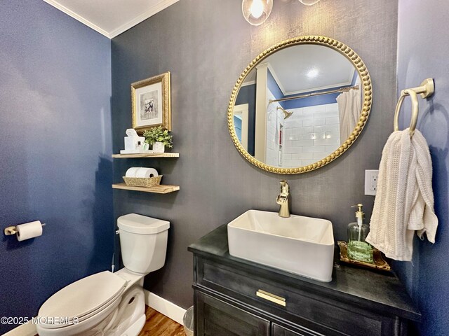 8 Spruce St, Toms River, NJ 08753 - bathroom featuring crown molding, toilet, wood finished floors, vanity, and baseboards