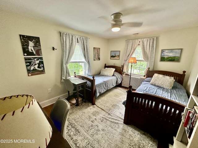 8 Spruce St, Toms River, NJ 08753 - bedroom with radiator, wood finished floors, baseboards, and a ceiling fan