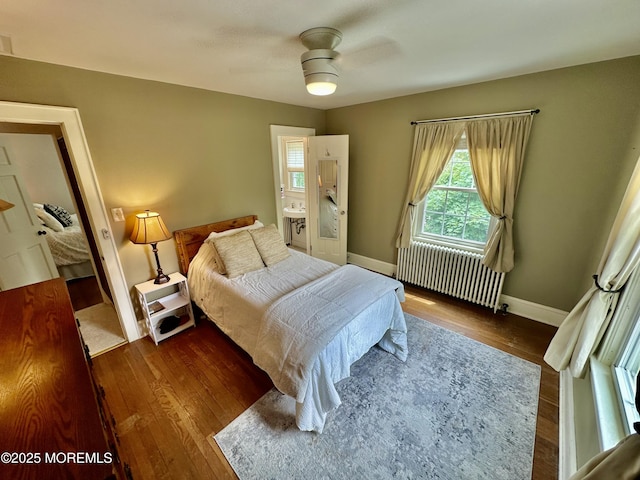 8 Spruce St, Toms River, NJ 08753 - bedroom featuring radiator heating unit, dark wood-type flooring, and baseboards