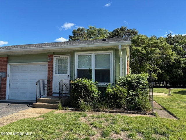 10 Monmouth Ln Unit B, Whiting, NJ 08759 - view of front of property featuring an attached garage, brick siding, and a front lawn