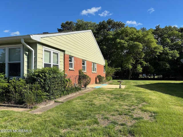 10 Monmouth Ln Unit B, Whiting, NJ 08759 - view of property exterior featuring a yard