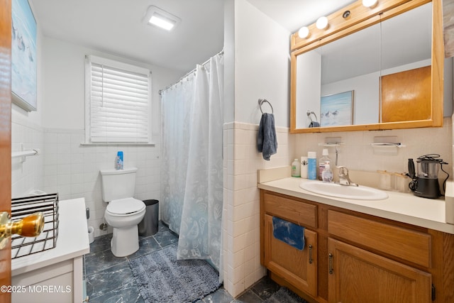 952 Stafford Dr, Toms River, NJ 08753 - bathroom with tile walls, vanity, tile patterned floors, toilet, and wainscoting