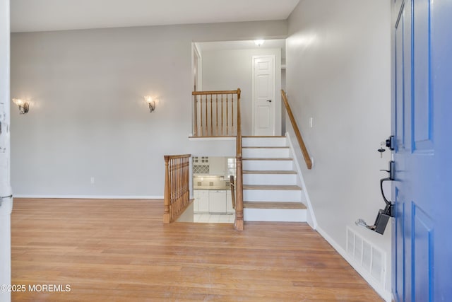 26 Nevada Dr, Hazlet, NJ 07730 - entrance foyer with light wood-style floors, baseboards, and stairs