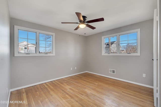 26 Nevada Dr, Hazlet, NJ 07730 - unfurnished room with baseboards, light wood finished floors, and a ceiling fan