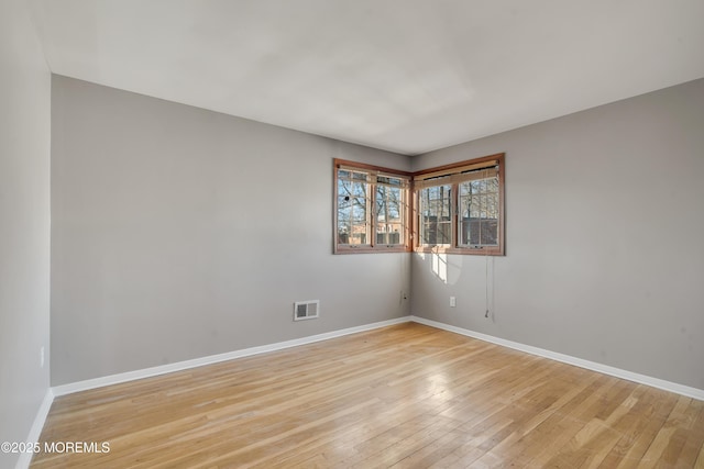 26 Nevada Dr, Hazlet, NJ 07730 - unfurnished room with light wood finished floors and baseboards