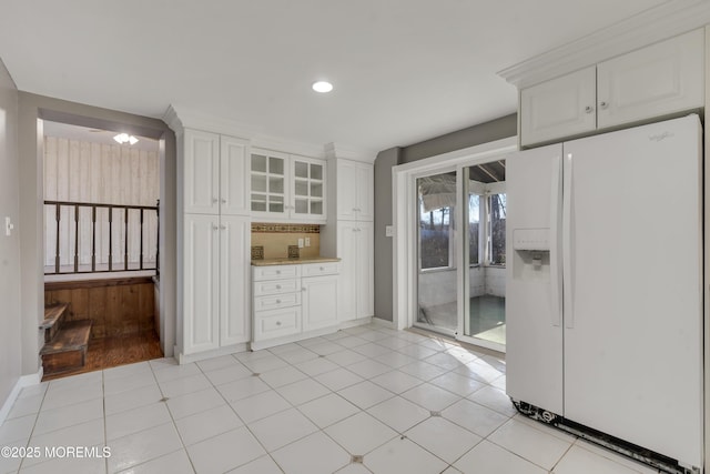 26 Nevada Dr, Hazlet, NJ 07730 - kitchen with white fridge with ice dispenser, white cabinets, light countertops, glass insert cabinets, and recessed lighting