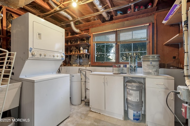 26 Nevada Dr, Hazlet, NJ 07730 - laundry room with stacked washing machine and dryer and cabinet space