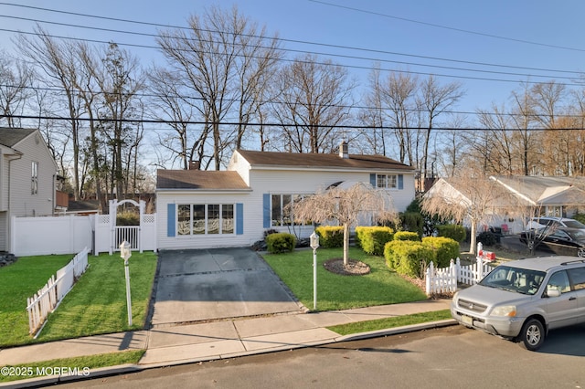 26 Nevada Dr, Hazlet, NJ 07730 - view of front of home with a chimney, driveway, and a gate
