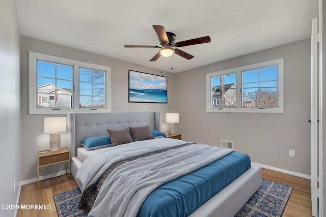 26 Nevada Dr, Hazlet, NJ 07730 - bedroom with light wood finished floors, baseboards, and a ceiling fan