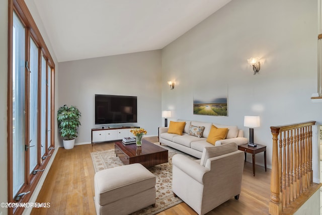 26 Nevada Dr, Hazlet, NJ 07730 - living room with light wood-style flooring, high vaulted ceiling, and baseboards