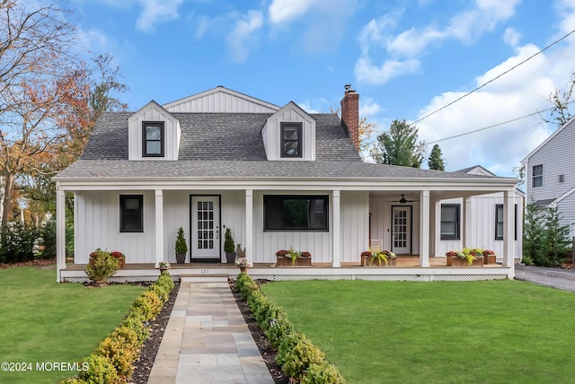 137 Church St, Fair Haven, NJ 07704 - view of front of home featuring a porch, board and batten siding, a chimney, a shingled roof, and a front lawn