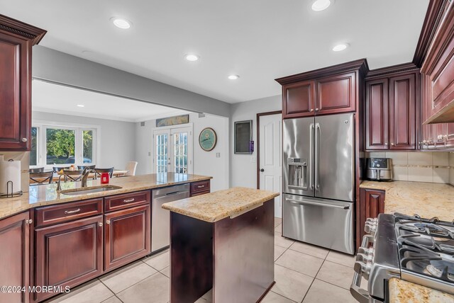 137 Church St, Fair Haven, NJ 07704 - kitchen featuring stainless steel appliances, reddish brown cabinets, french doors, recessed lighting, and decorative backsplash