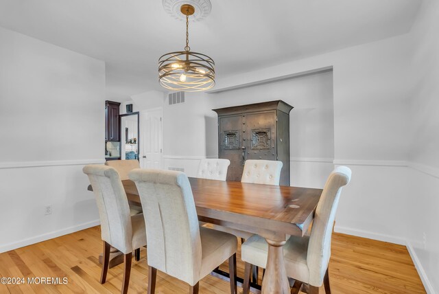 137 Church St, Fair Haven, NJ 07704 - dining space with a chandelier and light wood finished floors