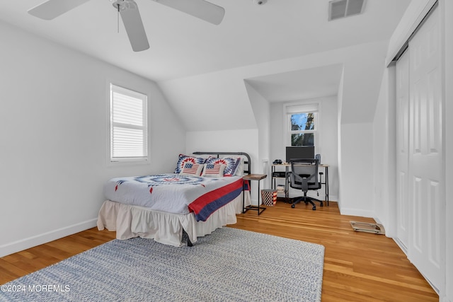 137 Church St, Fair Haven, NJ 07704 - bedroom with wood finished floors, multiple windows, a closet, vaulted ceiling, and a ceiling fan
