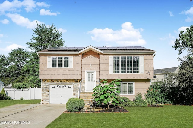 18 Croman Ct, Hazlet, NJ 07730 - split foyer home featuring driveway, roof mounted solar panels, a garage, and stone siding