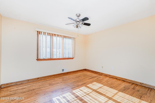 18 Croman Ct, Hazlet, NJ 07730 - empty room with light wood finished floors and a ceiling fan