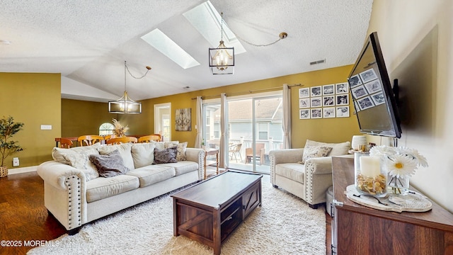 280 Tulip Ln, Freehold, NJ 07728 - living area featuring a skylight, wood finished floors, a textured ceiling, lofted ceiling, and baseboards