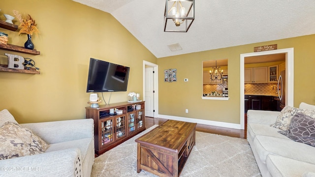280 Tulip Ln, Freehold, NJ 07728 - living area with a chandelier, lofted ceiling, and baseboards