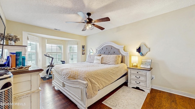 280 Tulip Ln, Freehold, NJ 07728 - bedroom with dark wood-type flooring, baseboards, a ceiling fan, and a textured ceiling