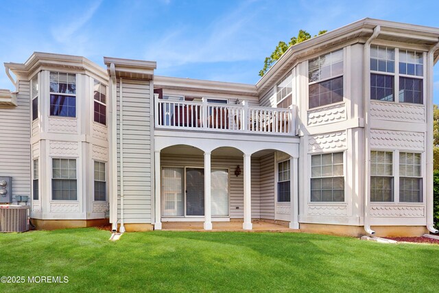 280 Tulip Ln, Freehold, NJ 07728 - rear view of property with a balcony, central AC unit, and a lawn