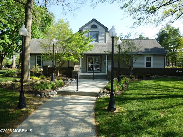 280 Tulip Ln, Freehold, NJ 07728 - view of front of house featuring a front lawn, roof with shingles, and a porch