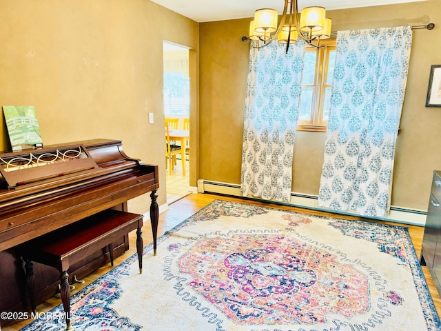 7 Rosewood Dr, Milltown, NJ 08850 - sitting room featuring a chandelier, plenty of natural light, and wood finished floors